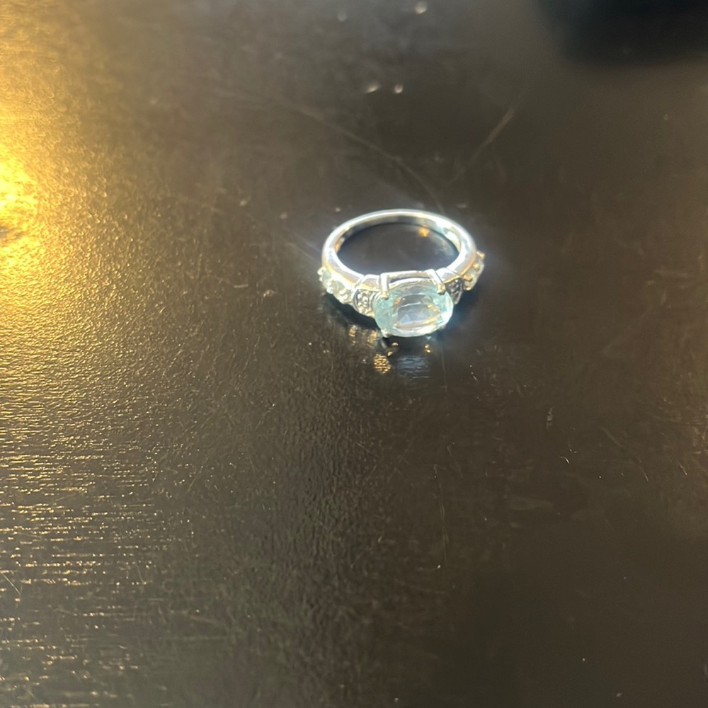 Light blue ring in silver setting size 6. Never worn